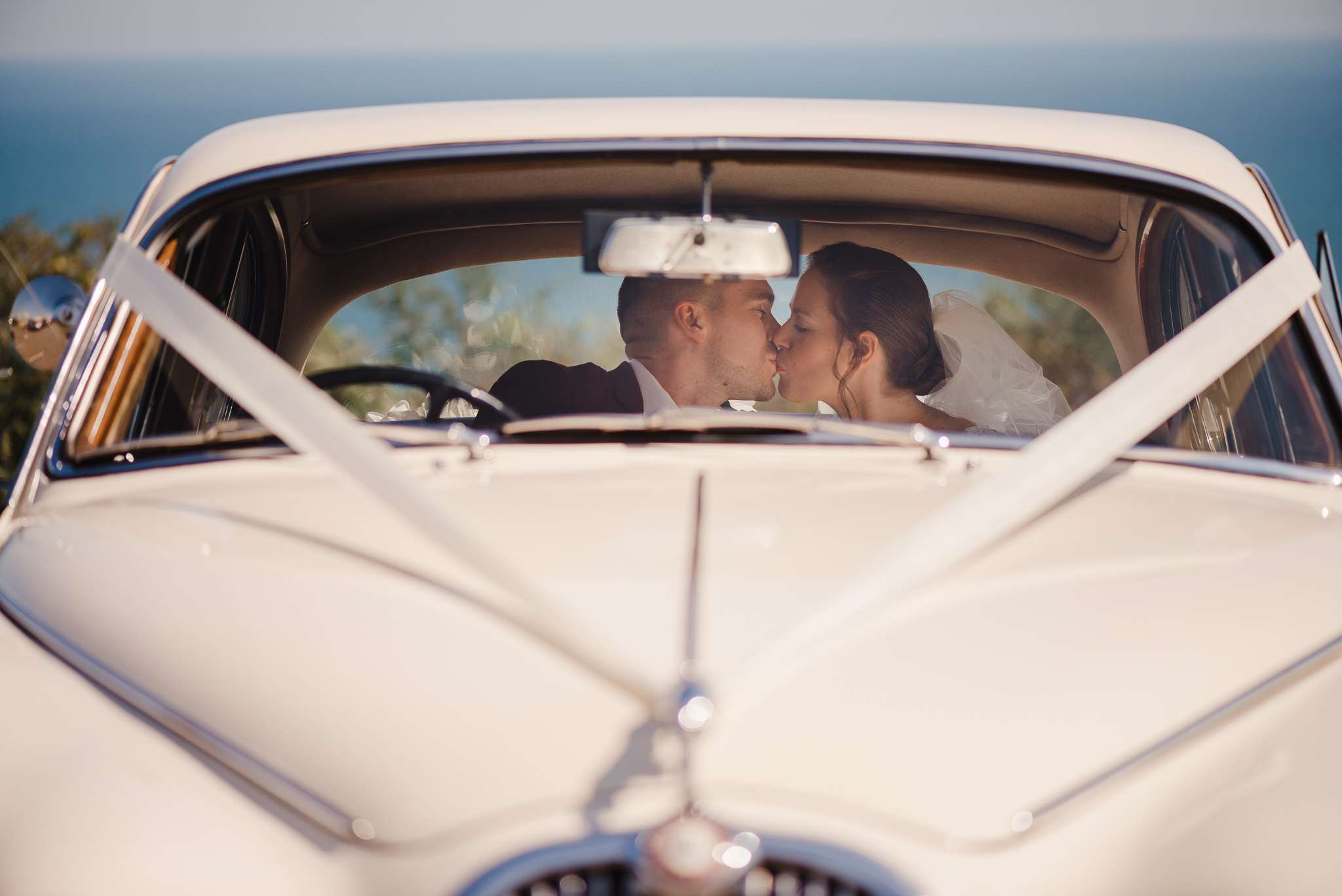 Wedding Couple Kissing In Classic Car | Cornwall Wedding Photography