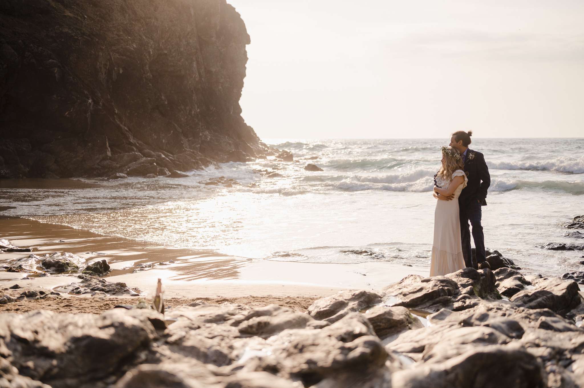 The Top Wow Factor Wedding Venues in Cornwall and Devon | Lusty Glaze | Cornwall Wedding Photographer | Cornwall Wedding Venues | Couple standing at Chapel Porth Beach