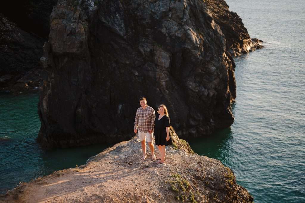 Best Locations for an Engagement Photoshoot in Cornwall | Cornwall Wedding Photographer | Kynance Cove | Couple standing next to waters edge