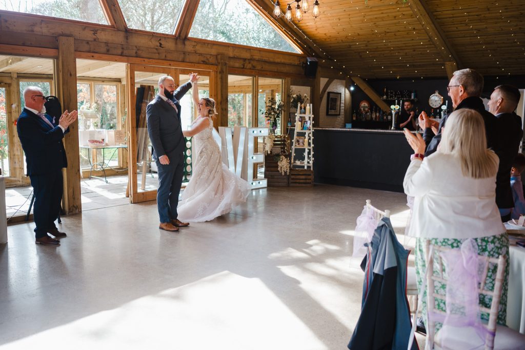 Walking into their wedding reception for the first time as Mr and Mrs at Chycara