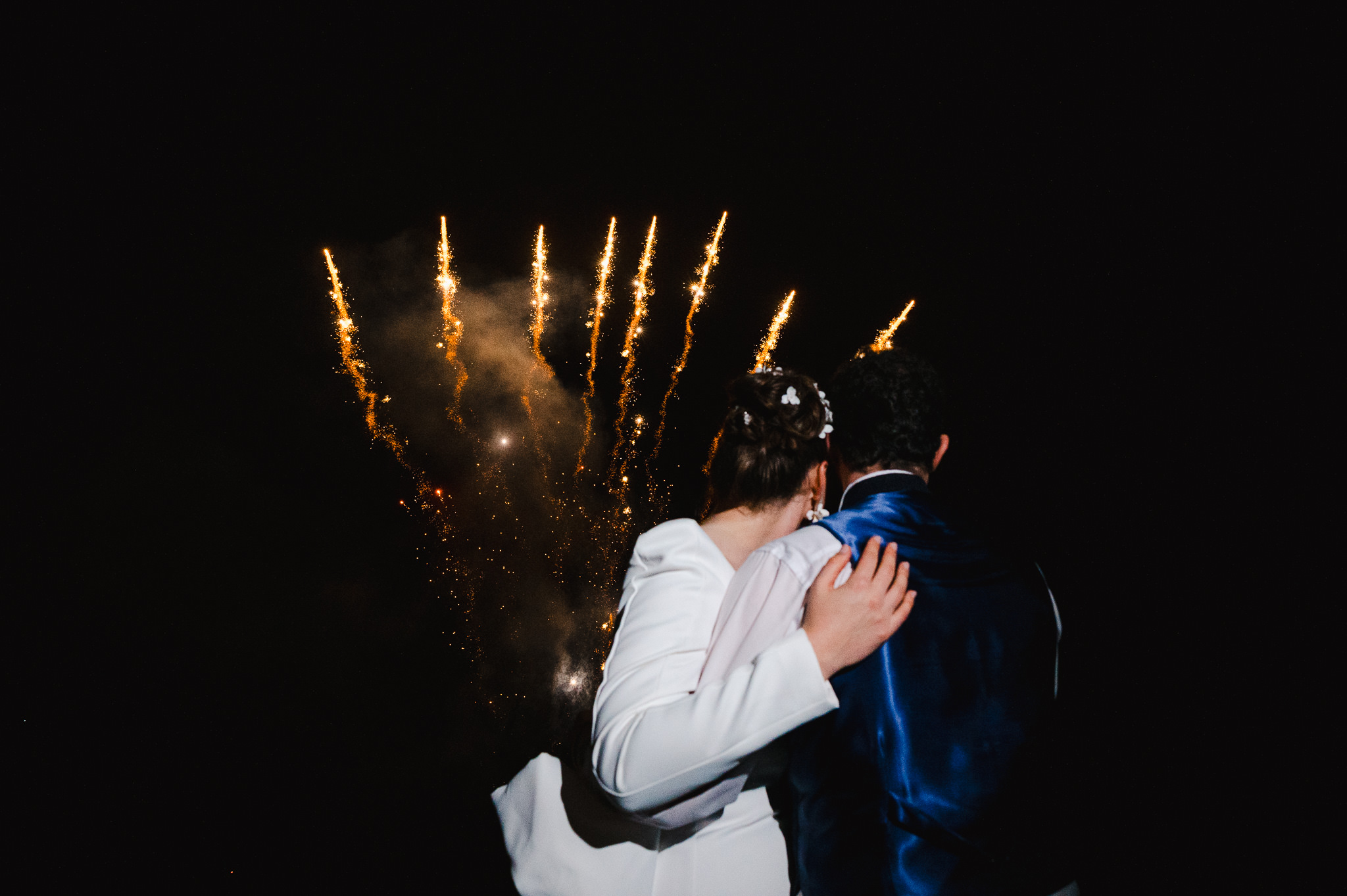 Fireworks in the background on the couples wedding day