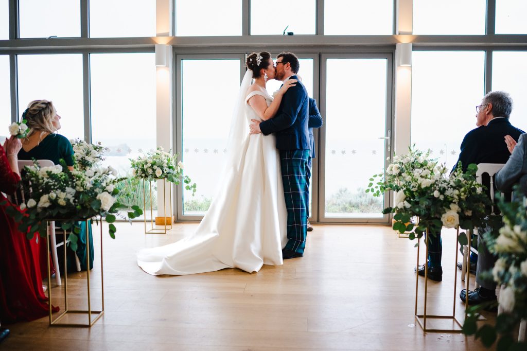 Bride and grooms first kiss