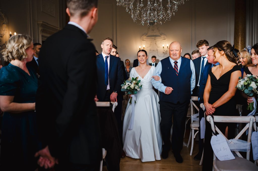 Walking down the aisle at Rockbeare Manor Wedding Venue